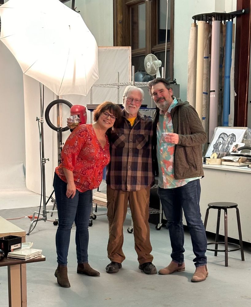 Brent with friends in a photo studio